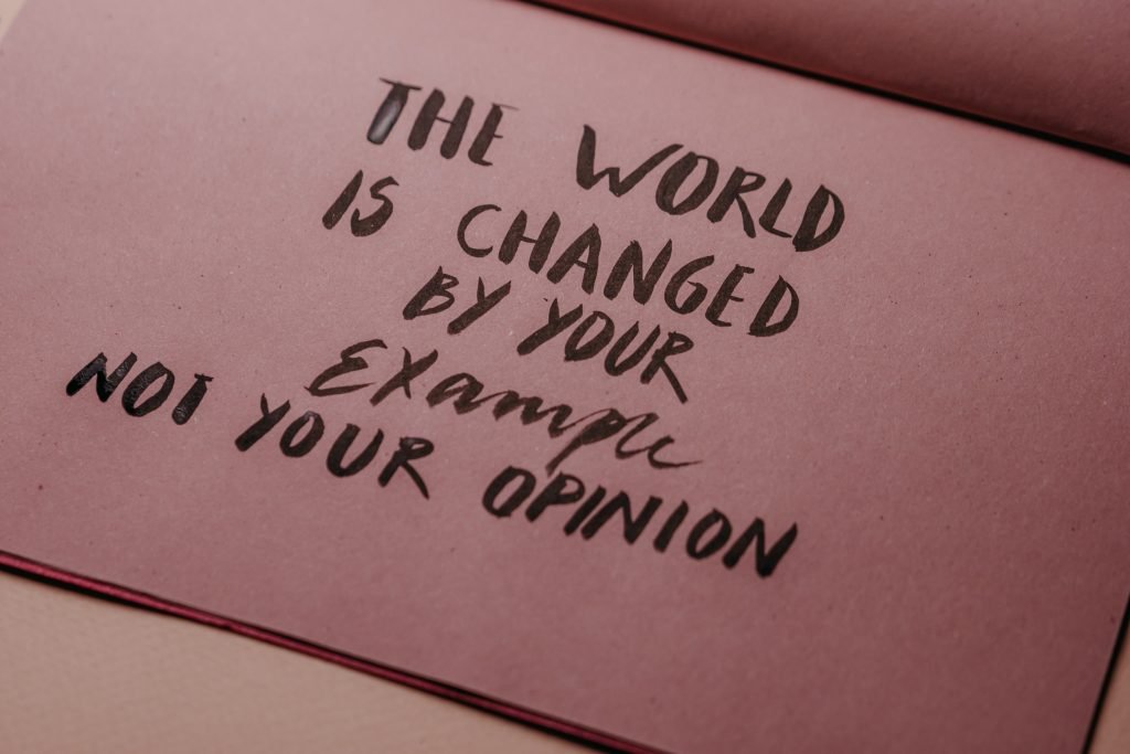 How to be more sustainable | Text: 'The wold is changed by your example, not your opinion'