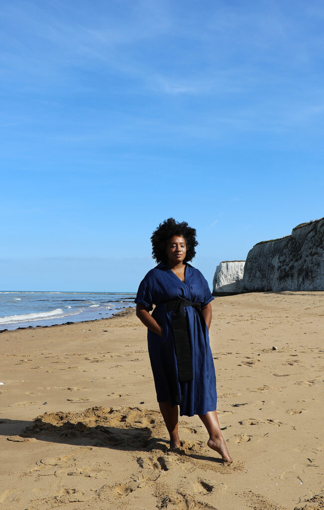 Aja Barber wearing Lora Gene blue dress