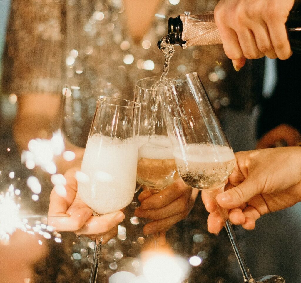 Sparkling wine being poured into flute glasses