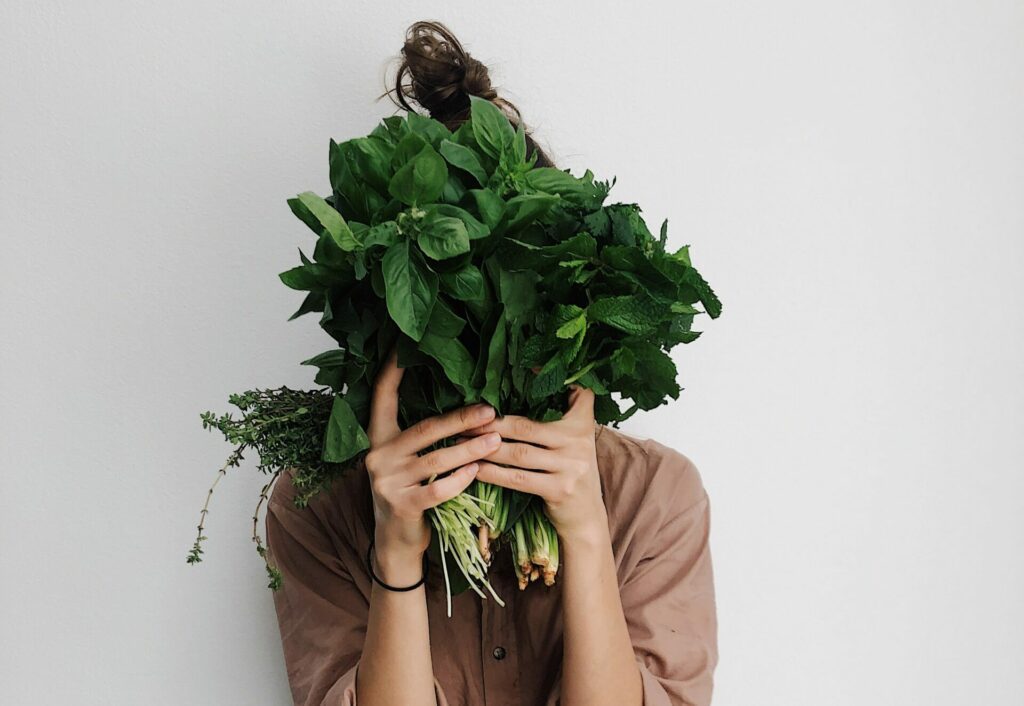 Woman holding greens | plant-based health