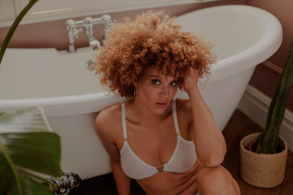 Peachaus ethical sleepwear and undwear | model sat by bathtub