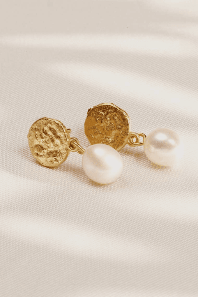 Gold disc earrings with drop pearl